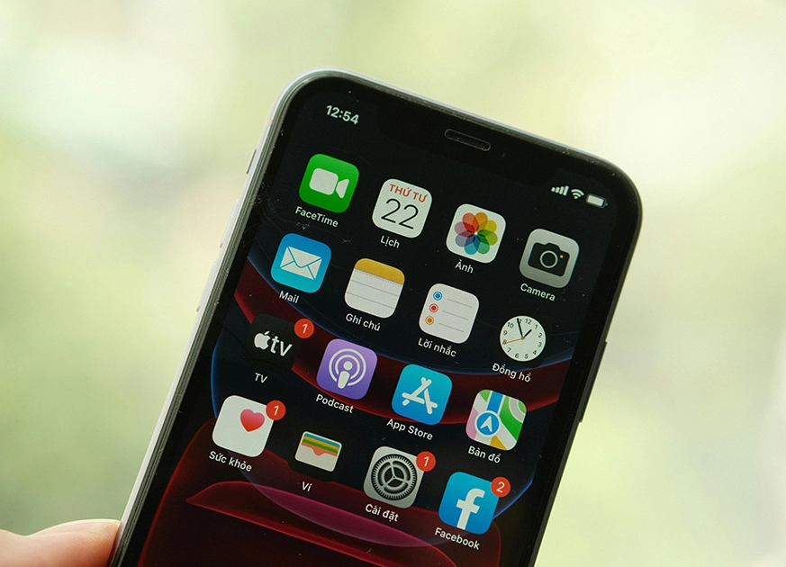 Close-up of a smartphone home screen showcasing various apps designed by a mobile app development company